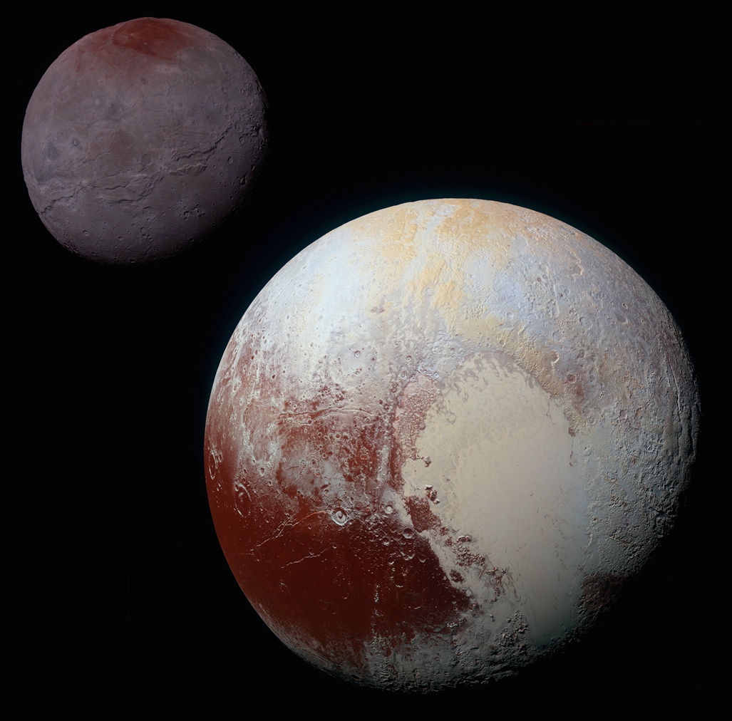 This composite of enhanced color images of Pluto (lower right) and Charon (upper.jpg