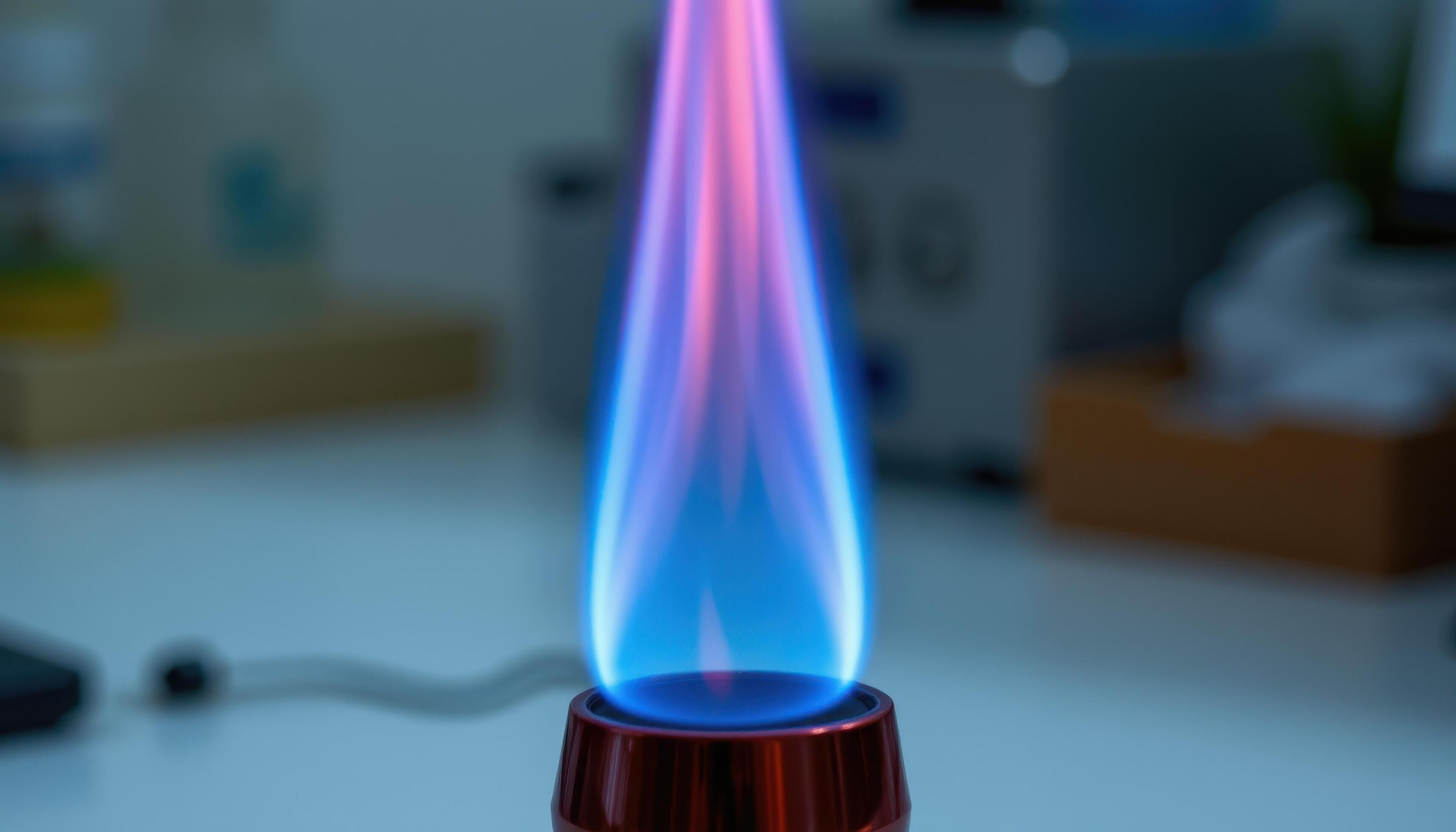 close-up-view-of-blue-flame-flaring-inside-a-laboratory-bunsen-burner-free-photo.jpeg